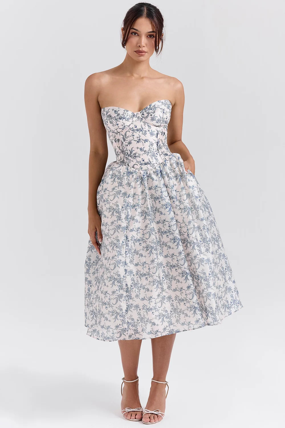 Woman wearing a dress against a clean studio background