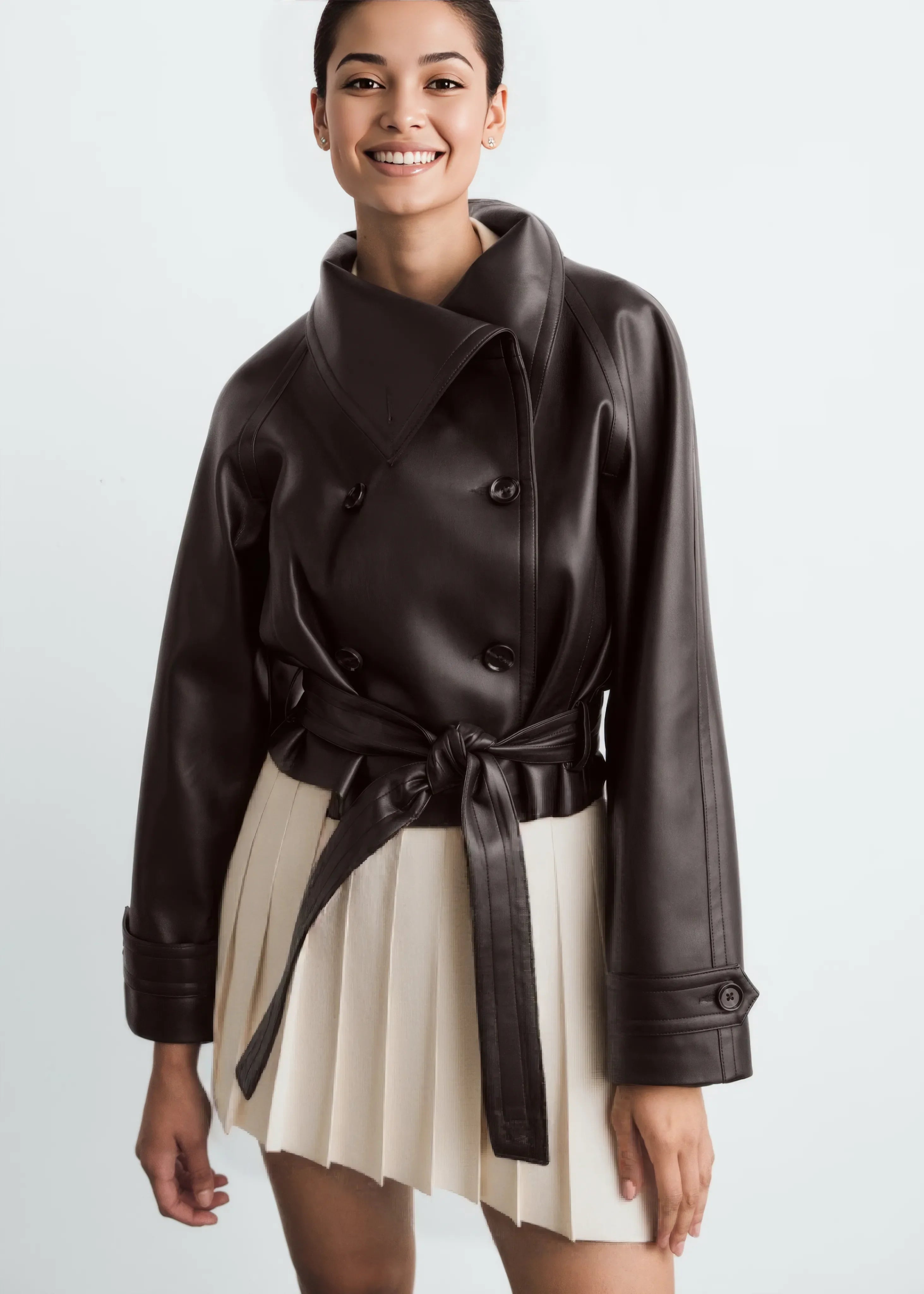 Woman wearing a jacket against a neutral studio background