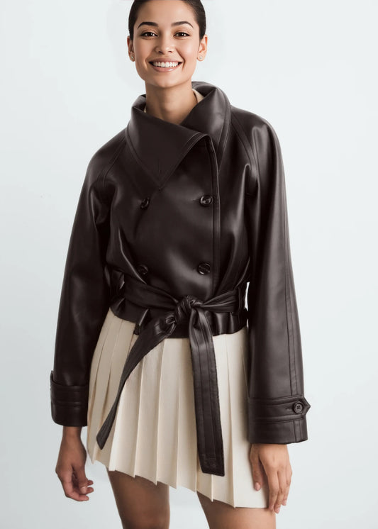 Woman wearing a jacket against a neutral studio background