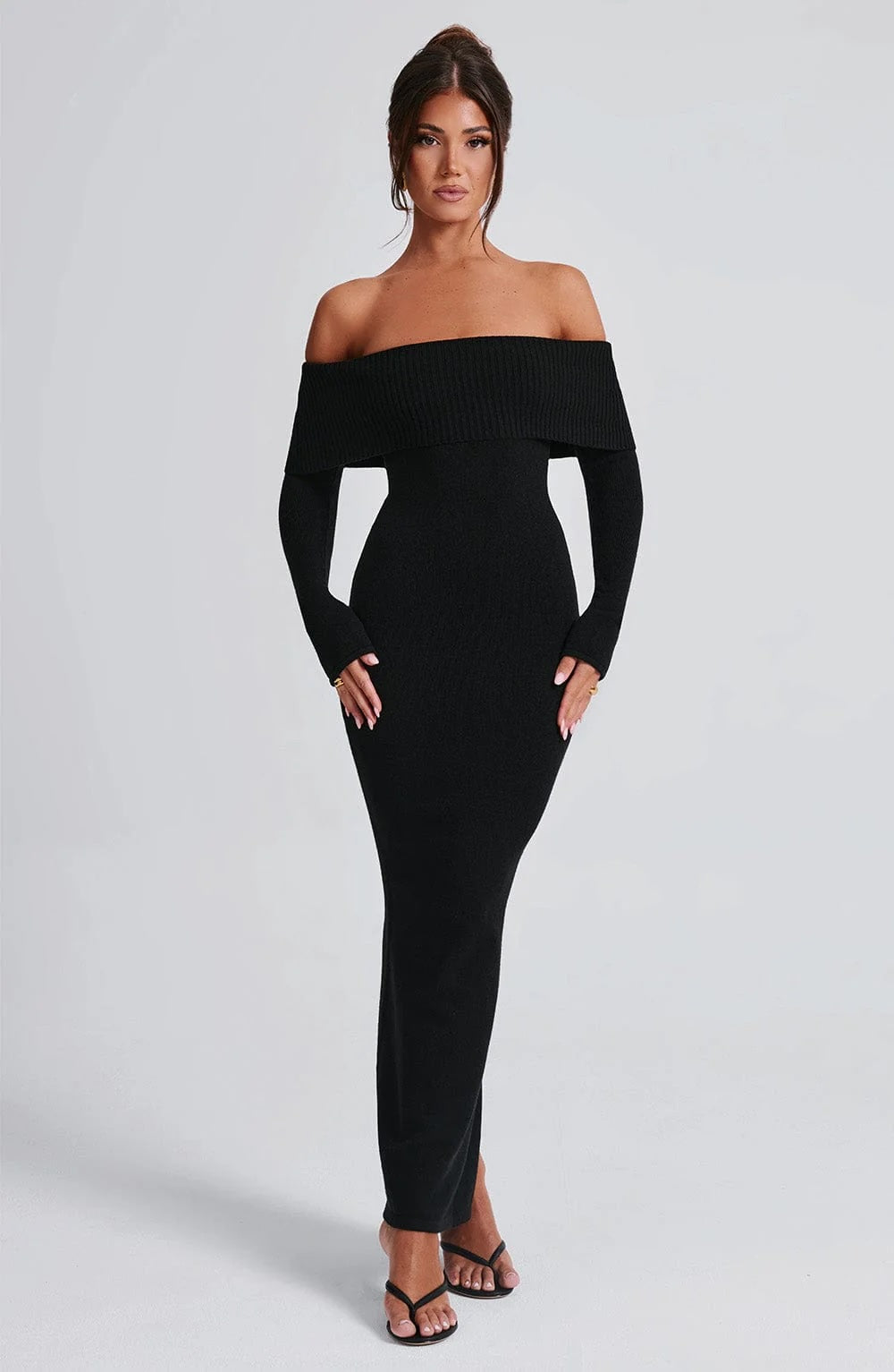 Woman wearing a dress against a clean studio background