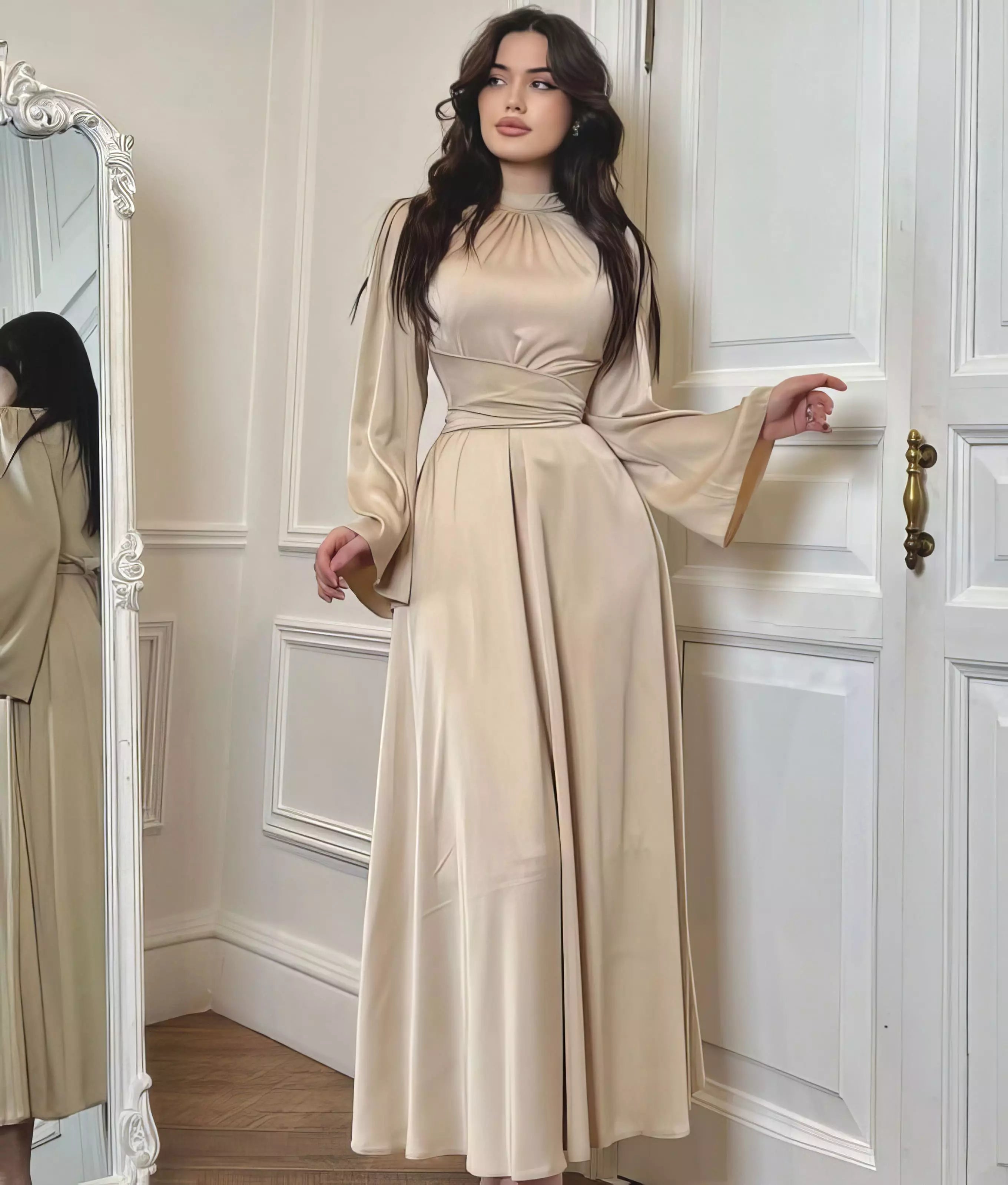 Woman wearing a satin dress against a clean studio background