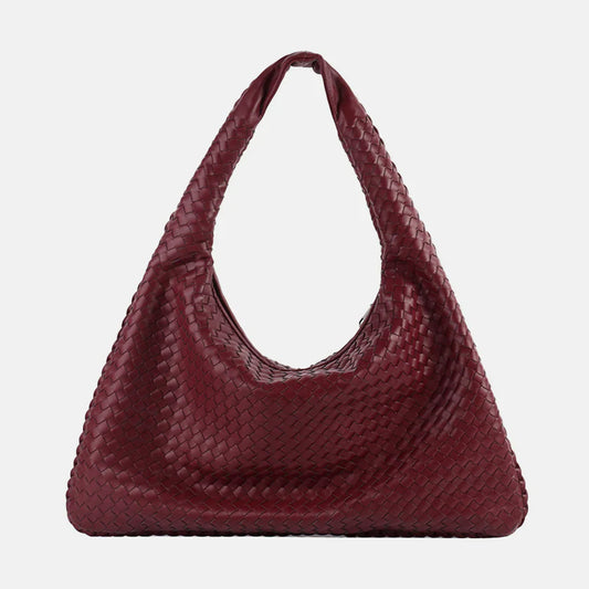 Woman wearing a bag against a clean background