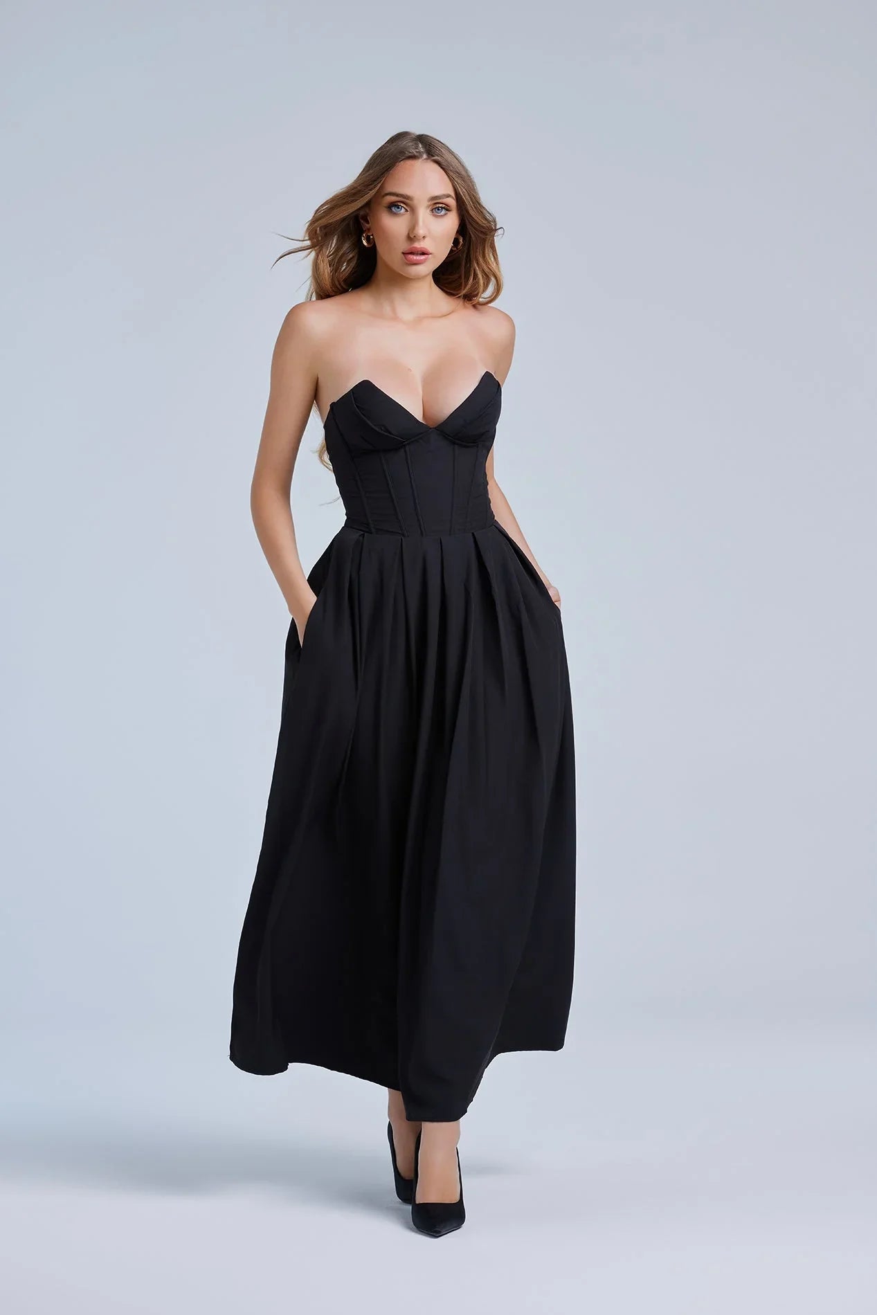 Woman wearing a dress against a clean studio background