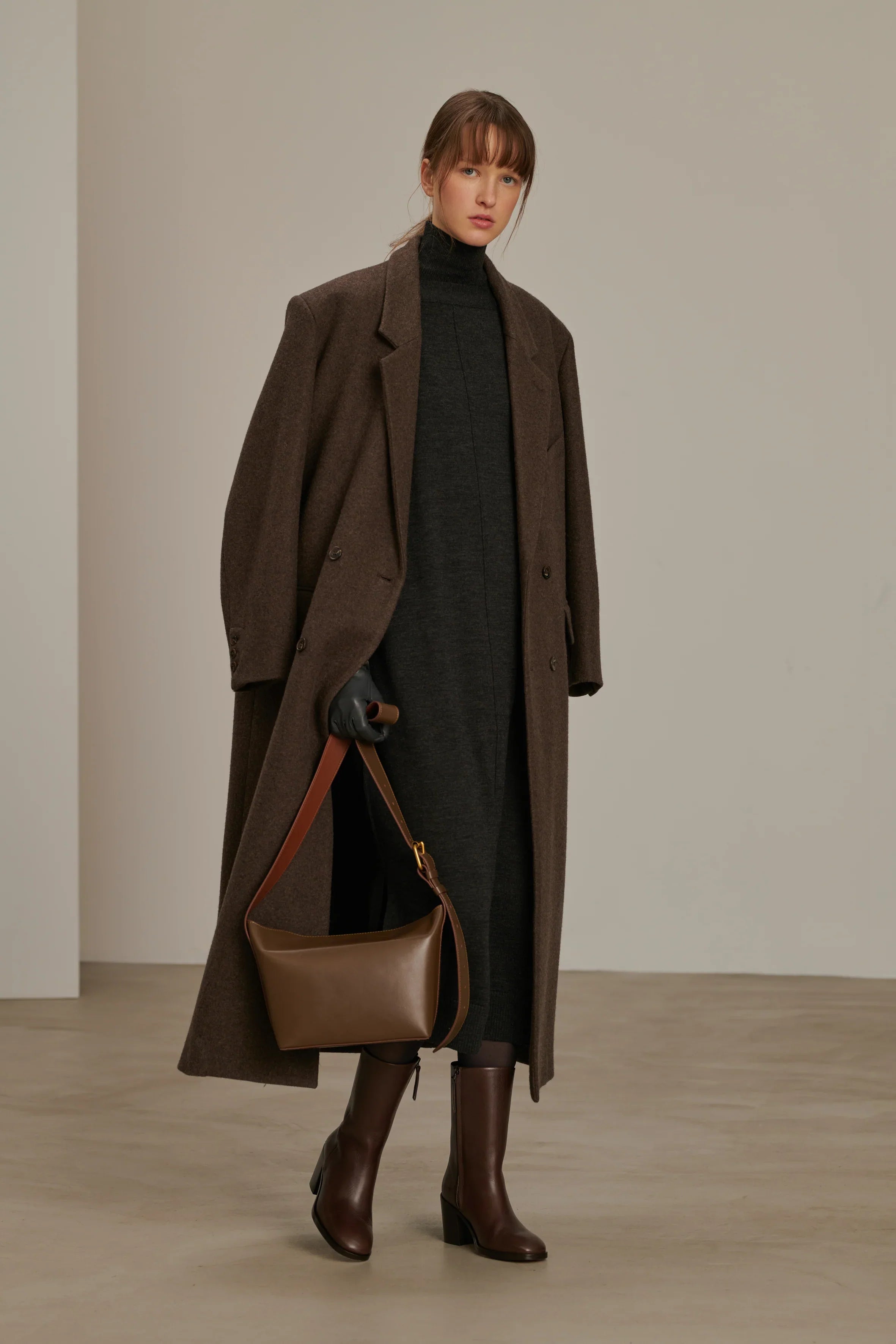 Woman wearing a jacket against a clean white background