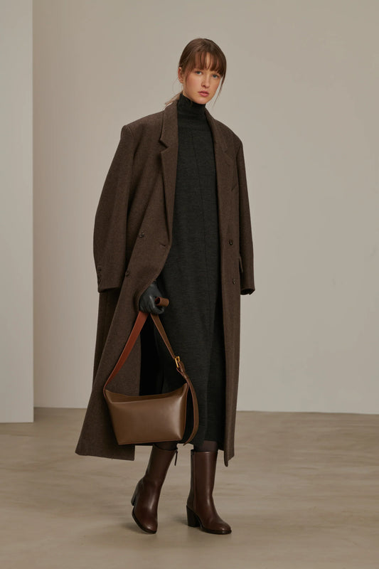Woman wearing a jacket against a clean white background