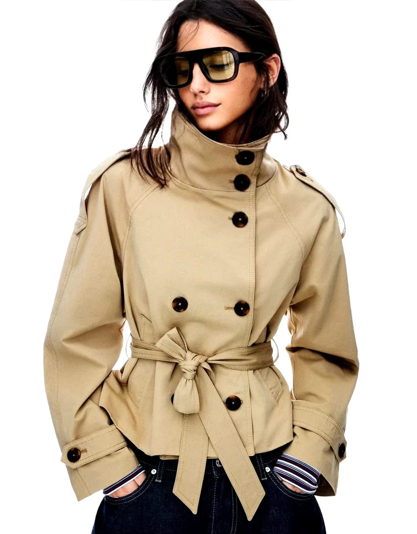 Woman wearing a jacket against a neutral studio background