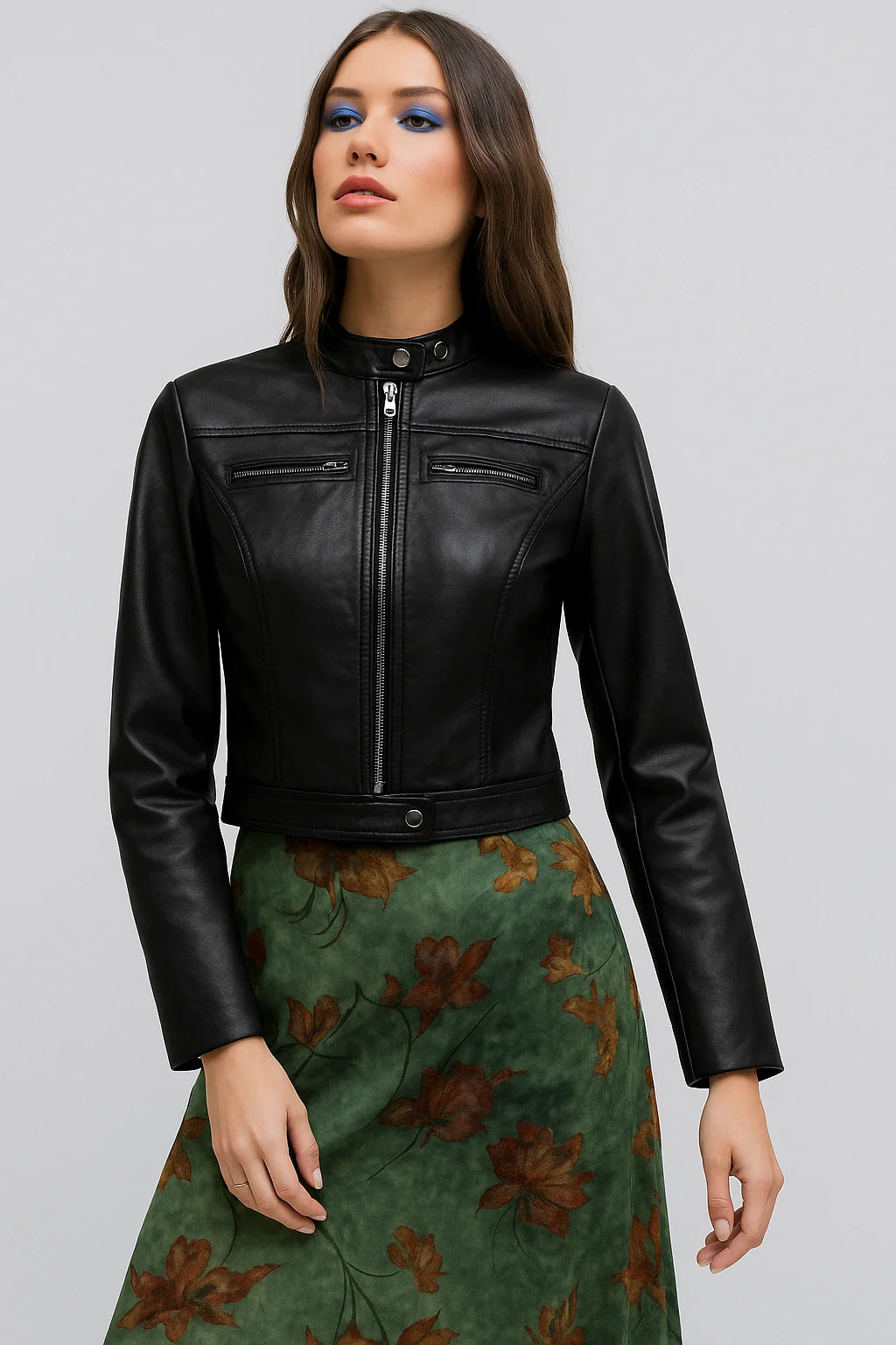 Woman wearing a jacket against a clean white background