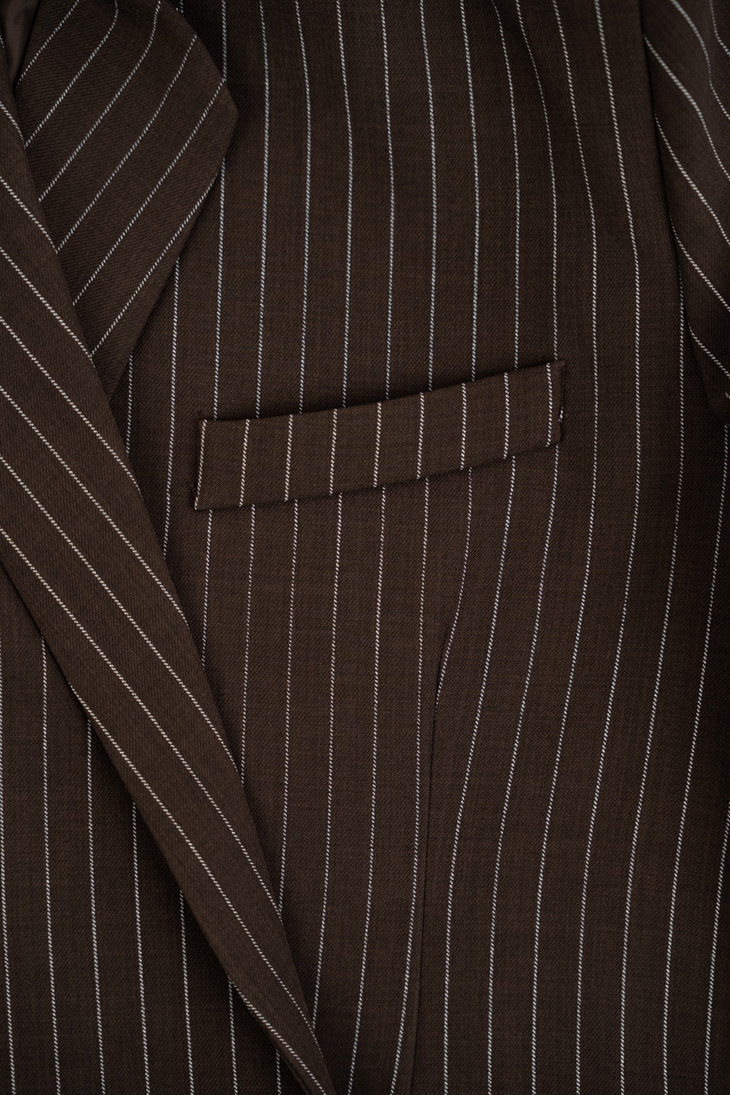 Brown pinstripe suit jacket with a pocket detail
