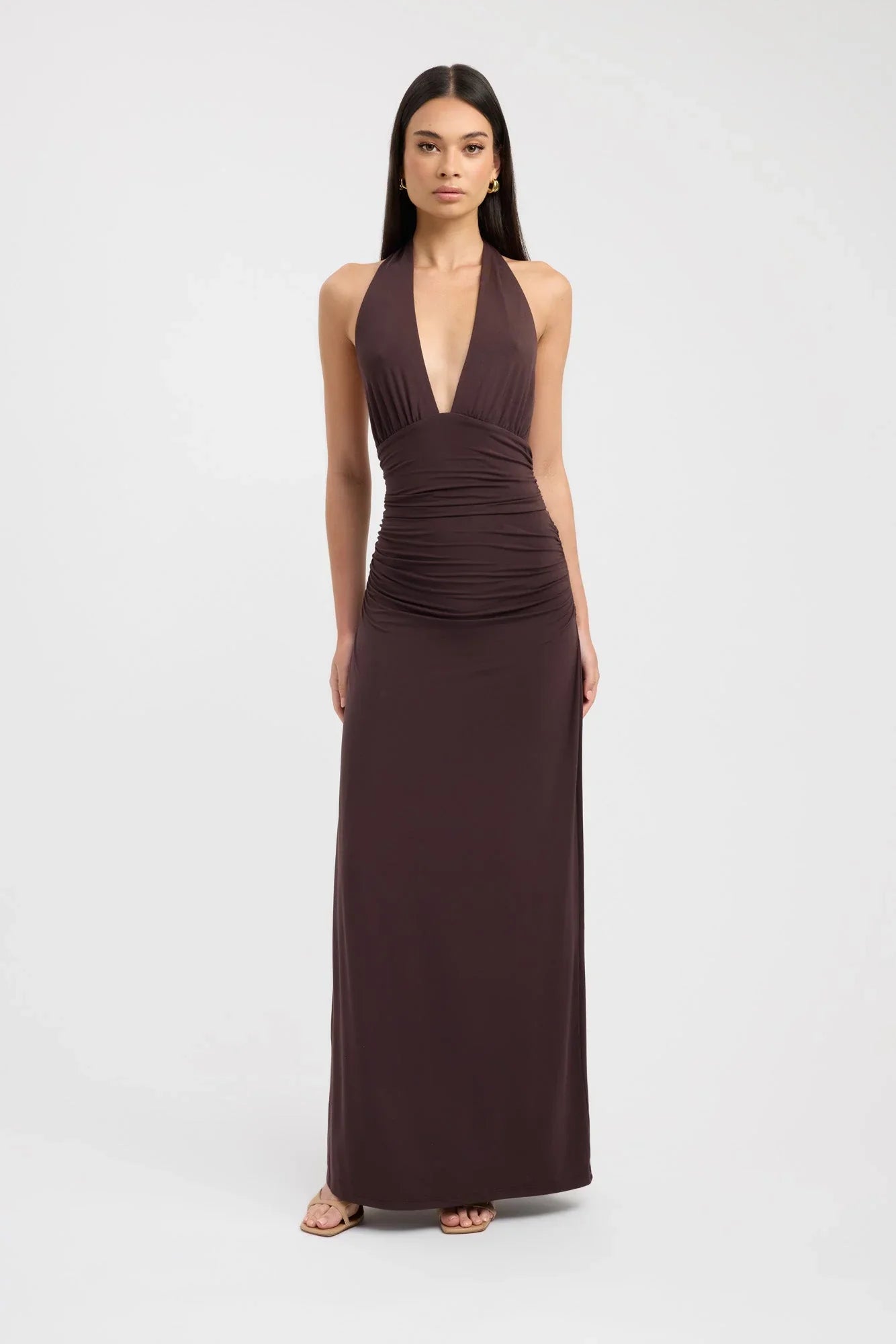Woman wearing a dress against a clean studio background