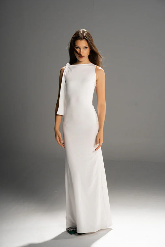 Woman wearing a dress against a clean studio background