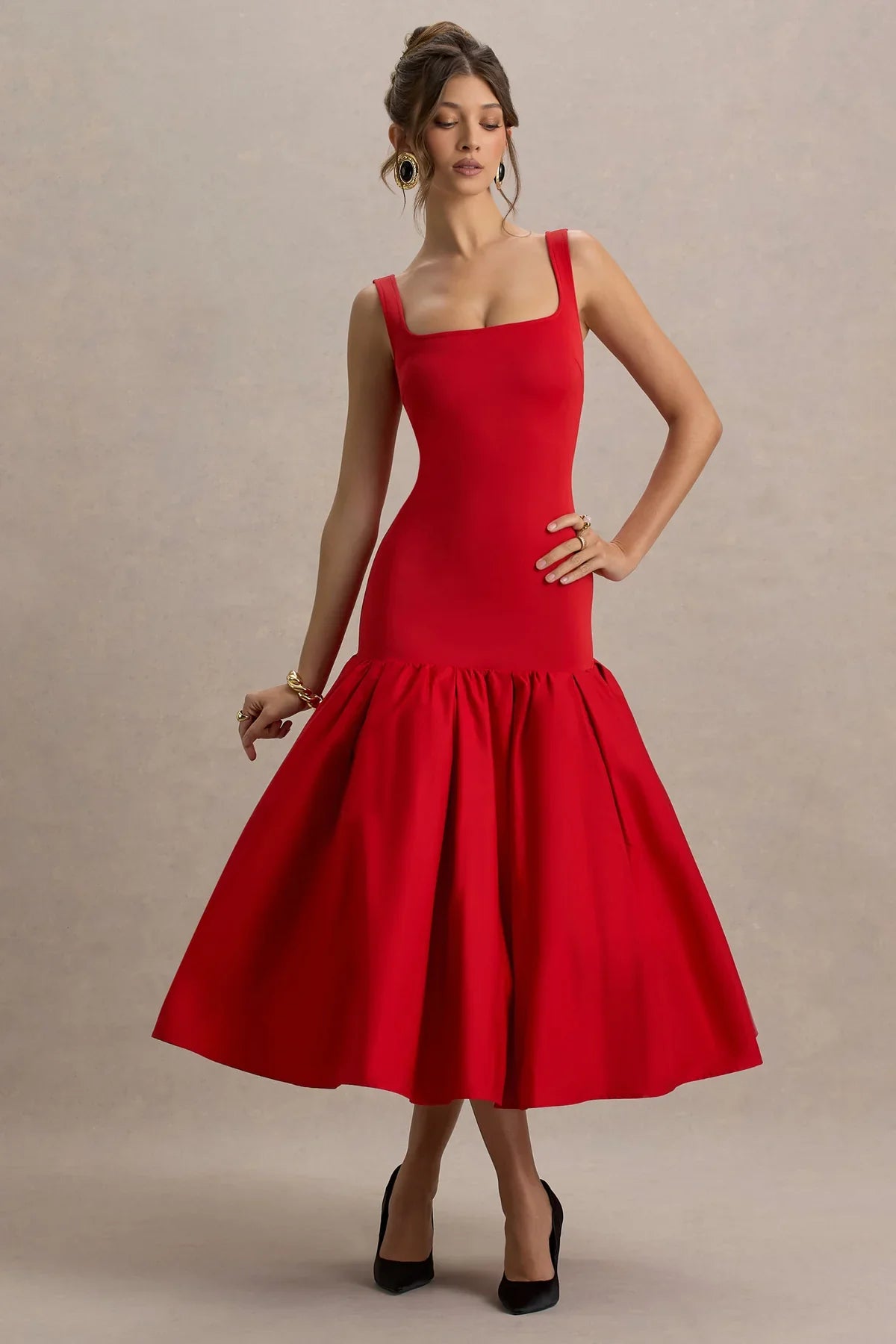 Woman wearing a dress against a clean studio background