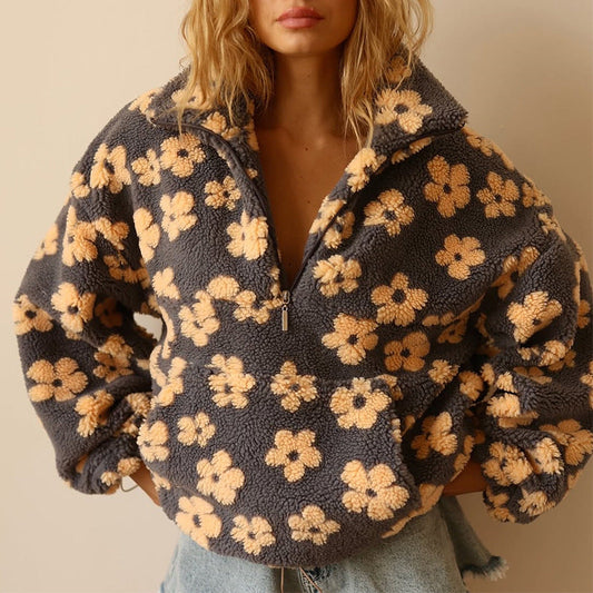 Woman wearing a coat against a neutral studio background