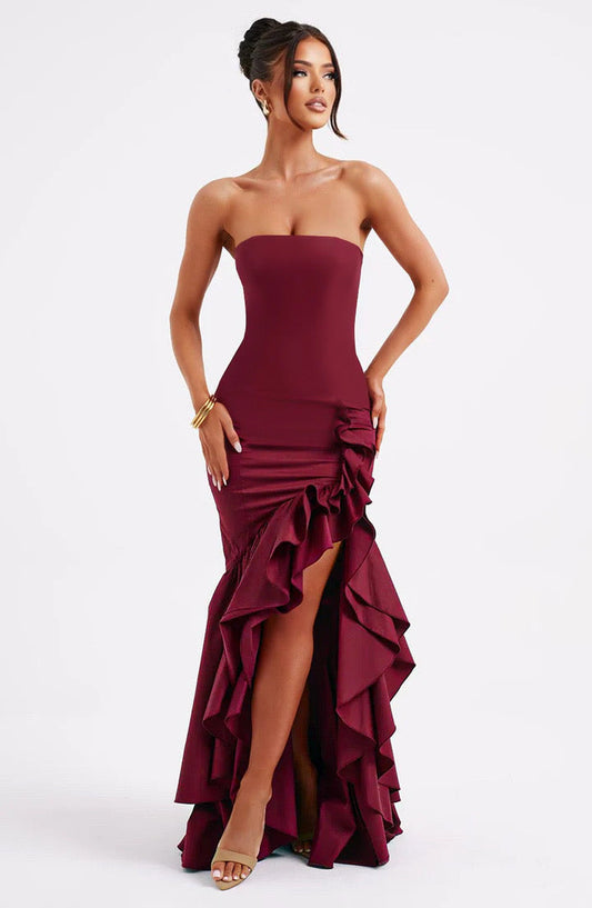 Woman wearing a mermaid dress against a clean studio background