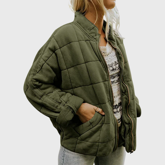 Woman wearing a sofie | cozy oversized mid-season jacket against a clean white background