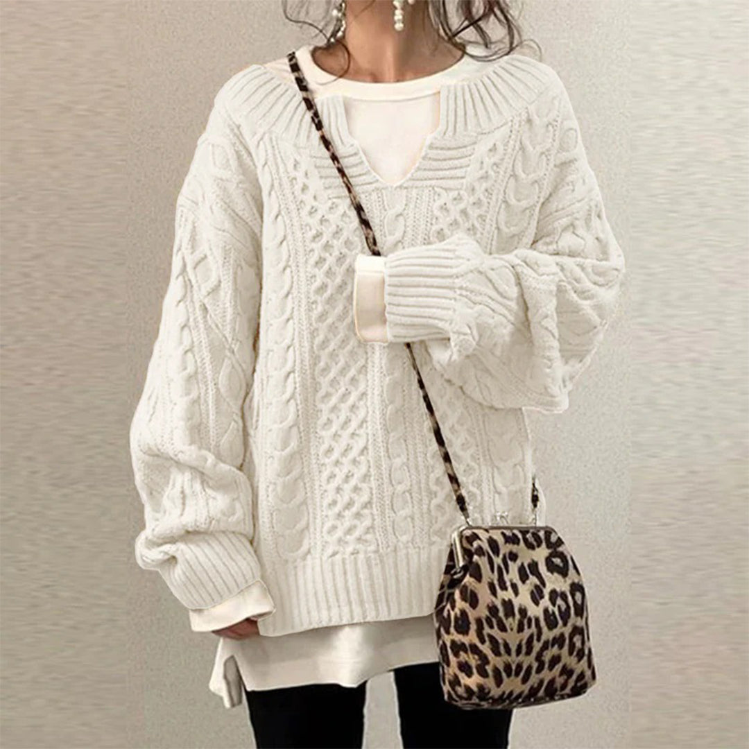 Man wearing a stacy | chunky knit oversized sweater against a light beige background