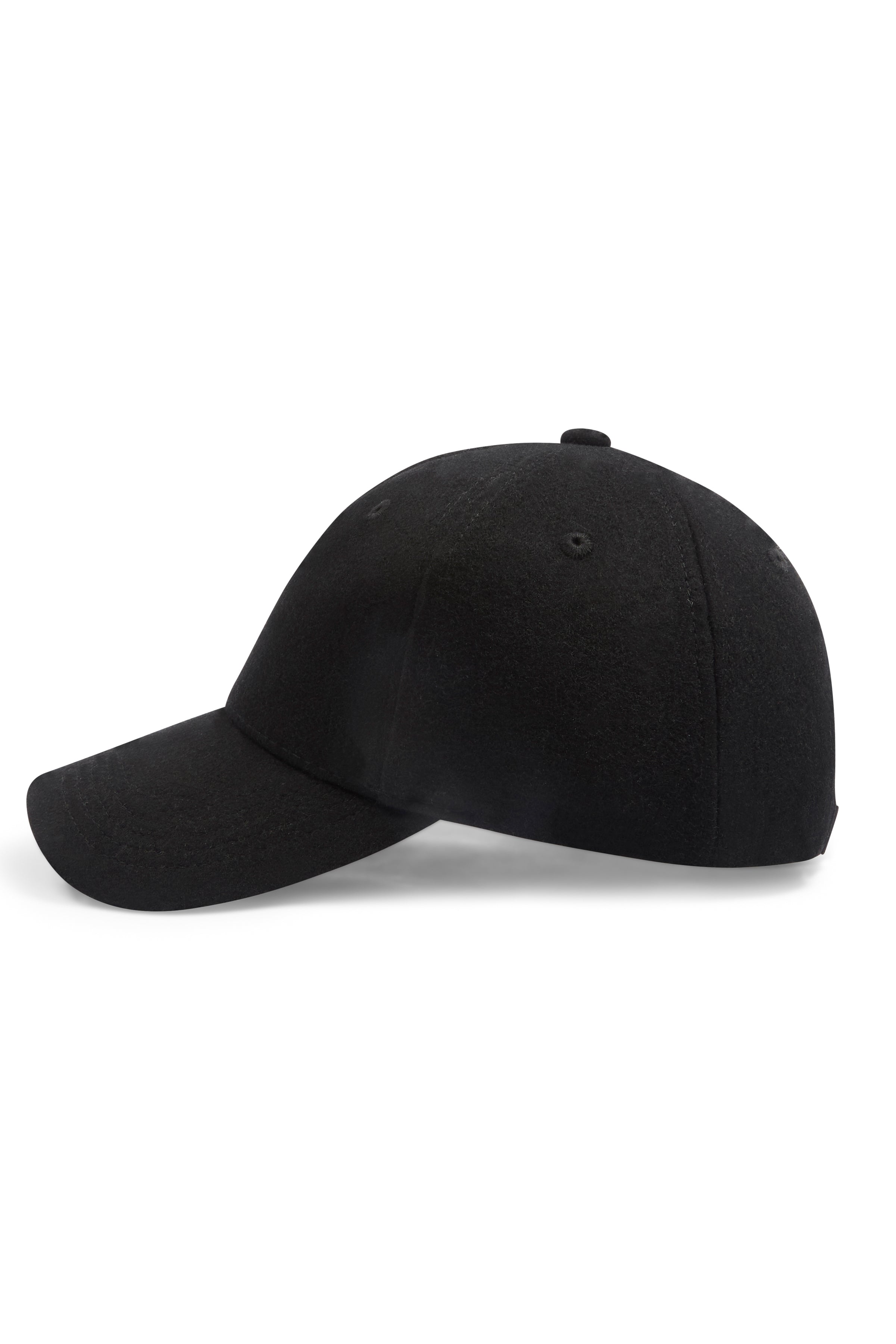 Man wearing a black wool beanie against a clean background