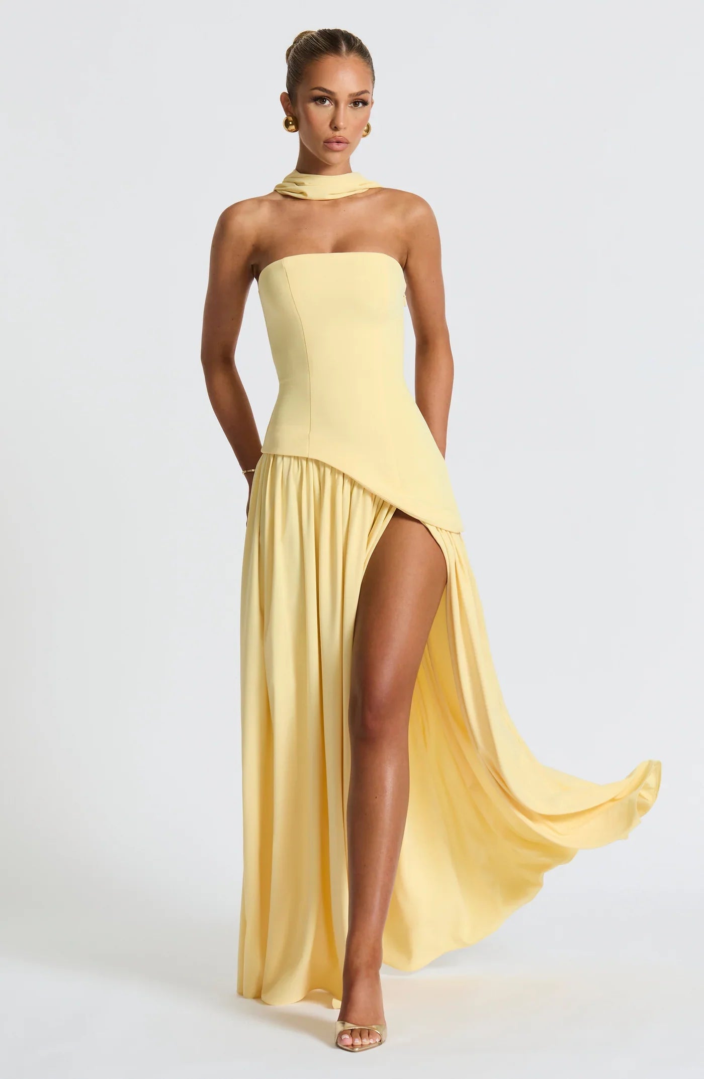 Woman wearing a gown against a clean studio background