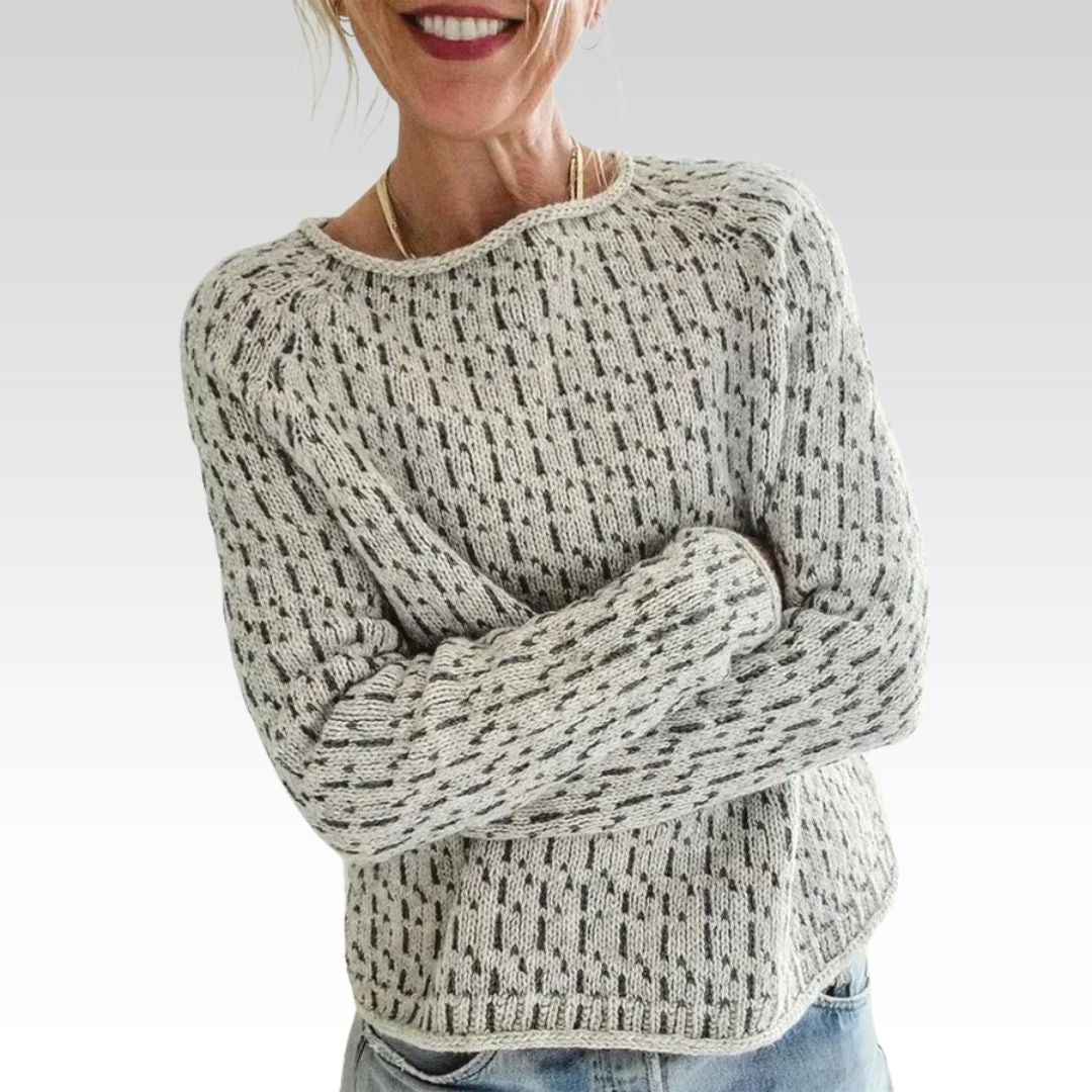 Man wearing a victoria | chic gray boat neck sweater against a light beige background