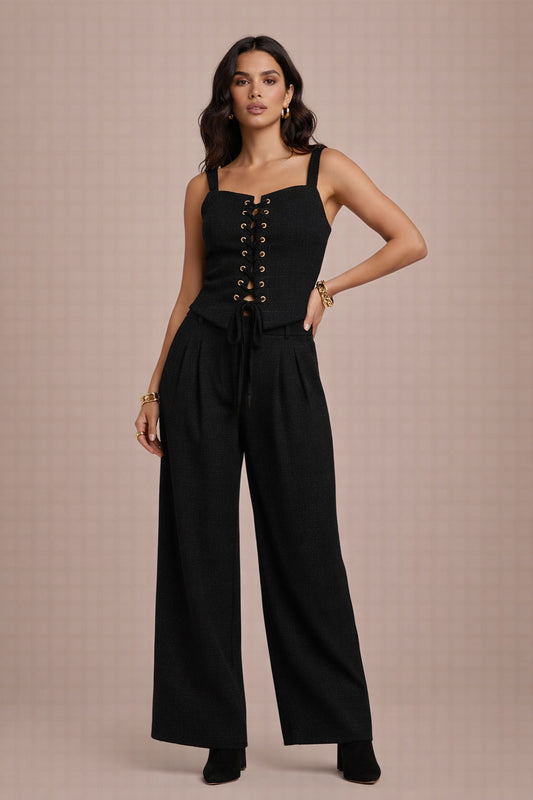 Woman wearing a co-ord set against a clean background