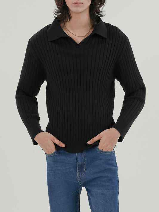 Man wearing a black sweater against a light beige background