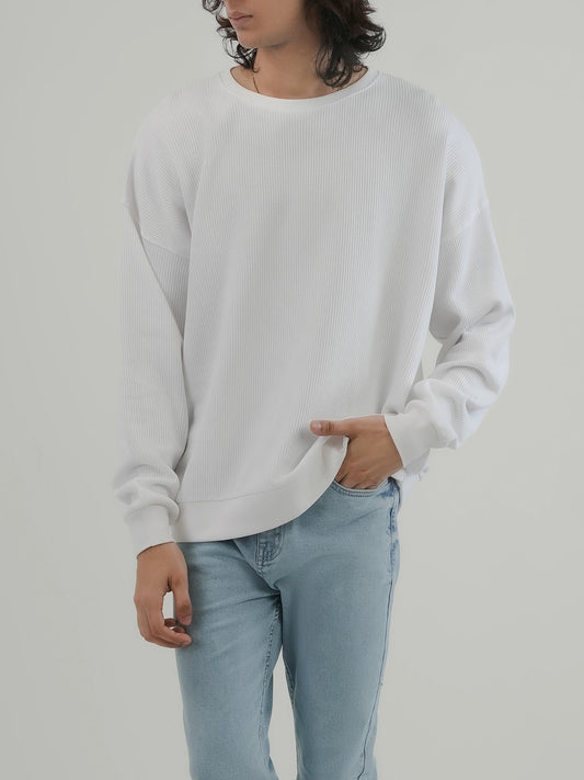Man wearing a white sweatshirt against a clean background