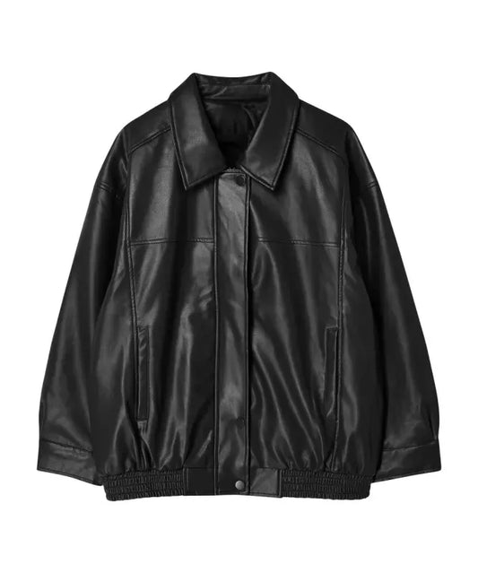 Woman wearing a jacket against a neutral studio background